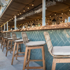 Chinchilla – an exclusive café chic rooftop venue in Camps Bay with a wooden rooftop a wooden live edge bar and bespoke wooden woven occasional chairs. Some seating supplied by Vintage-etc. We make custom made & bespoke tables, benches, free-standing kitchen islands, desks, media units & wardrobes in our Cape Town & Johannesburg workshops – using Oak, Oregon, Ash, Beech, Birch Ply & Meranti. We also sell imported furniture, provide design consulting services & make soft furnishings e.g. sofas & upholstered chairs in linen, velvet & stain resistant fabric.