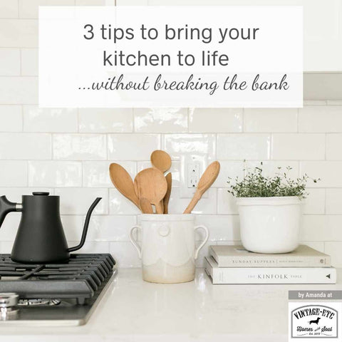 Blog cover displaying kitchen space with black metal stove top, a matte black coffee pot, cookery books, a pot plant, a storage piece with wooden spoons in it and a white tiled accent wall. Blog header on cover says, “3 tips to bring your kitchen to life without breaking the bank.” Interior design blog Written by vintage-etc in Cape Town. We make custom made & bespoke tables, benches, free-standing kitchen islands, desks, media units & wardrobes in our Cape Town & Johannesburg workshops – using Oak, Oregon, Ash, Beech, Birch Ply & Meranti. We also sell imported furniture, provide design consulting services & make soft furnishings e.g. sofas & upholstered chairs in linen, velvet & stain resistant fabric.