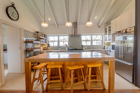 Bespoke Solid Oak free-standing kitchen island with baby blue drawers and cabinets, LED strip lights, an inset butchers block and solid Oak natural butt style barstools. Interior design blog about our tips on bringing your kitchen to life without spending too much money. Written by vintage-etc in Cape Town. We make custom made & bespoke tables, benches, free-standing kitchen islands, desks, media units & wardrobes in our Cape Town & Johannesburg workshops – using Oak, Oregon, Ash, Beech, Birch Ply & Meranti. We also sell imported furniture, provide design consulting services & make soft furnishings e.g. sofas & upholstered chairs in linen, velvet & stain resistant fabric.