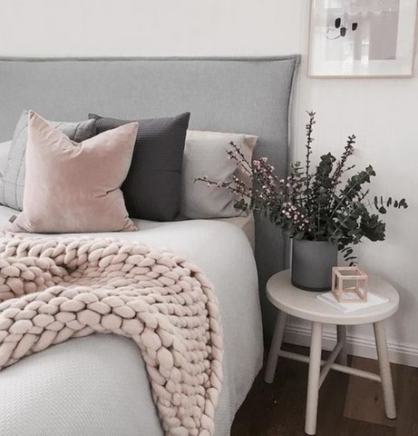 grey blush copper trend in bedroom with chunky knit blankets