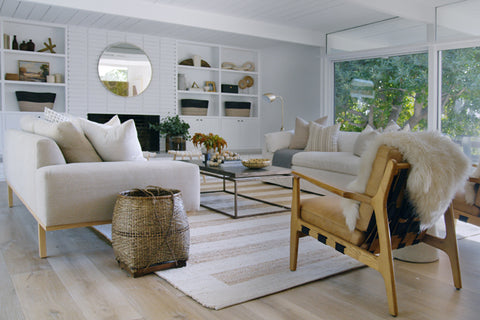 Living room showcasing solid oak or Oregon occasional chairs, a cream linen sofa, a tubular metal and stainless steel coffee table, fluffy textured throws and a rug. Blog post with 7 interior design tips taken from Netflix series Dream Home Makeover. Achieve this look with vintage-etc. We make custom made & bespoke tables, benches, free-standing kitchen islands, desks, media units & wardrobes in our Cape Town & Johannesburg workshops - using Oak, Oregon, Ash, Beech, Birch Ply & Meranti. We also sell imported furniture, provide design consulting services & make soft furnishing e.g. sofas & upholstered chairs in linen, velvet & stain resistant fabric 