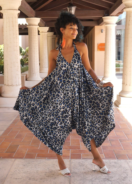 A woman wearing an anim al print harem jumpsuit