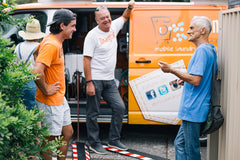 Orange Sky volunteers sharing conversation in Fortitude Valley, Brisbane