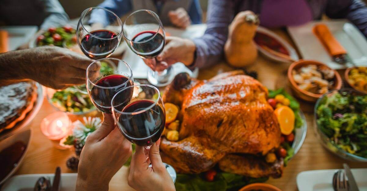 Family toasting over Thanksgiving dinner