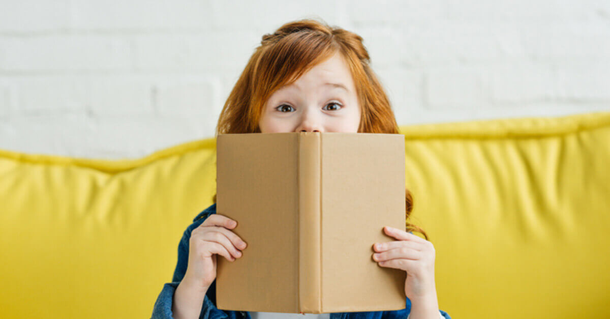 young girl reading: stress-relieving activity