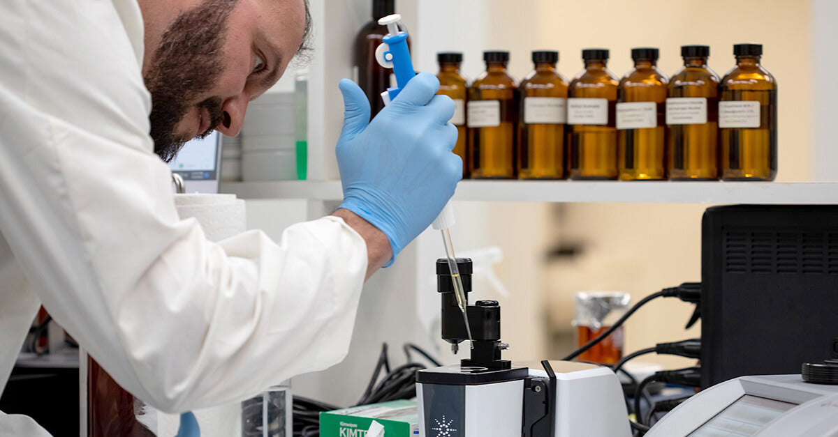 A man testing essential oils in a lab