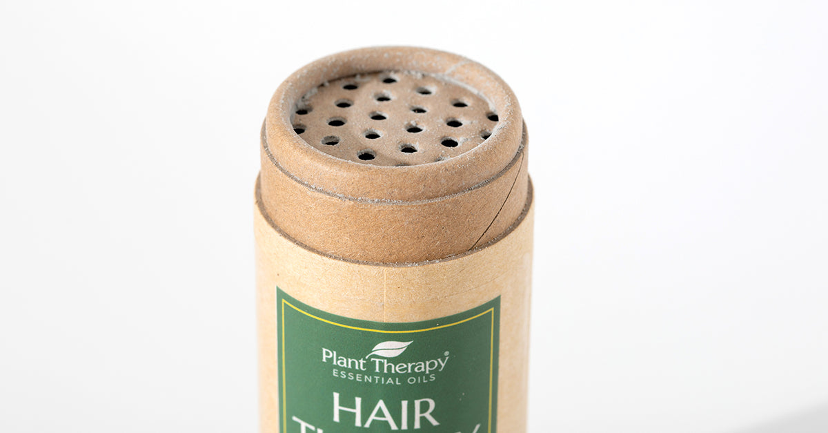 Close up of the Hair Therapy Dry Shampoo's cardboard packaging.