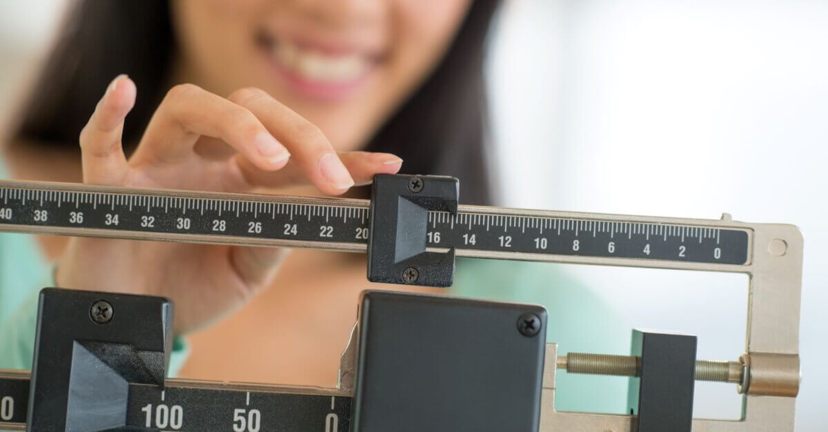 woman using a scale