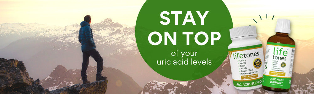 man standing on a mountain, looking over at other mountains. The words "stay on top of your uric acid levels" on a green circle on the right side of the image.