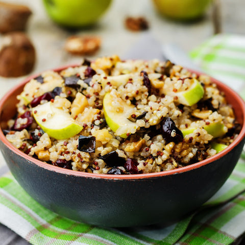 quinoa breakfast bowl with cranberries and apples