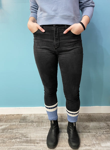 Girl wearing black jeans, black blundstones, and blue Voyageur cotton boot socks