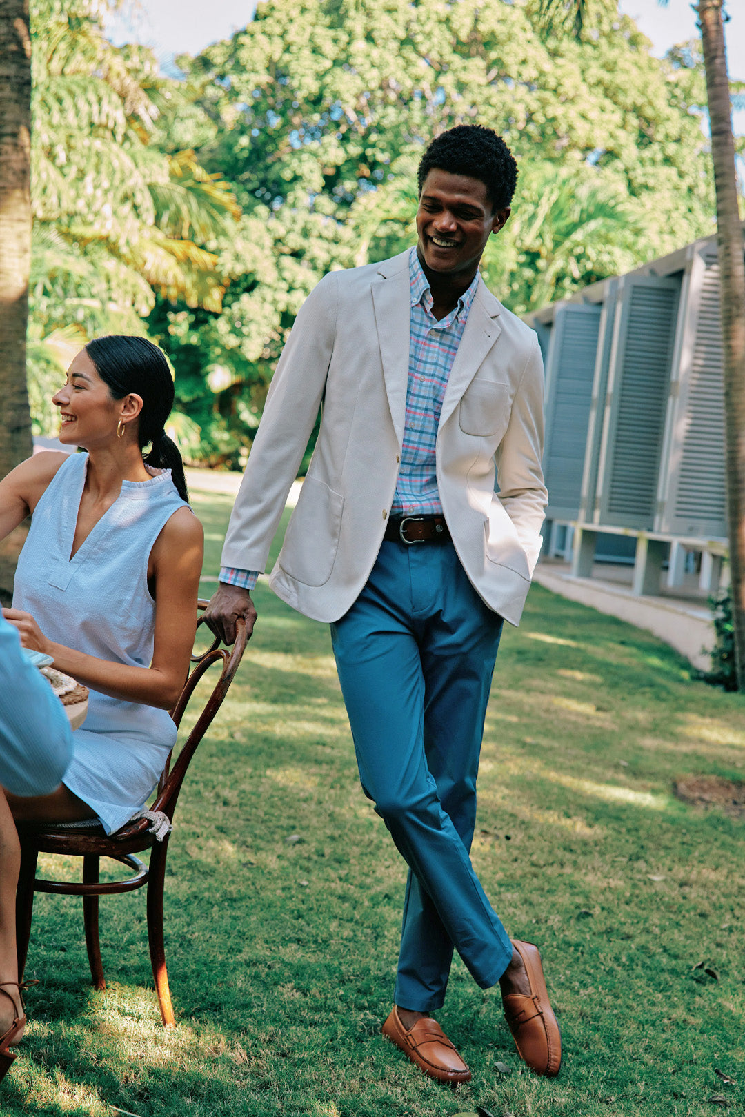 Man in preppy khaki blazer and dress pants at an easter dinner.