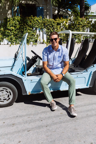 guy sitting in car wearing short sleeve button down