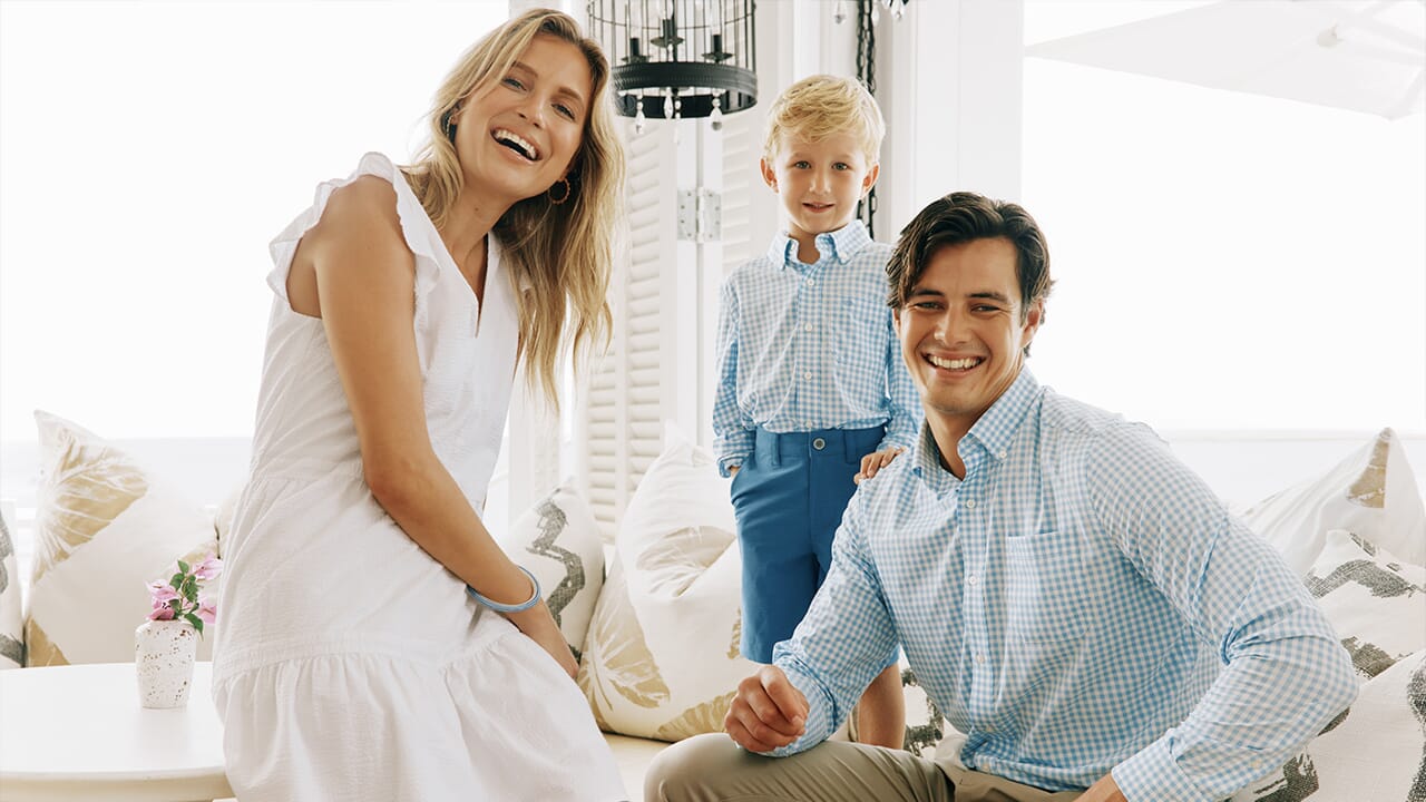 Family Dressed in Light Blue and White Seersucker Outfits