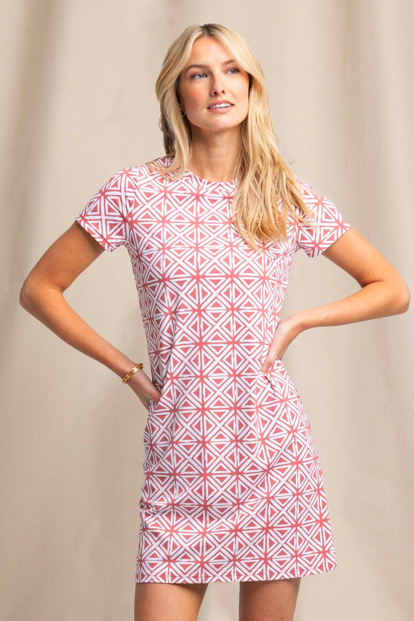 Woman in Coral Geometric Dress