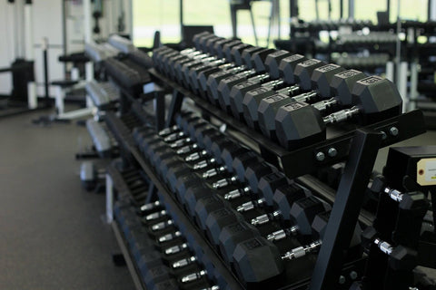 York Barbell Commercial Rubber Hex Dumbbells on rack