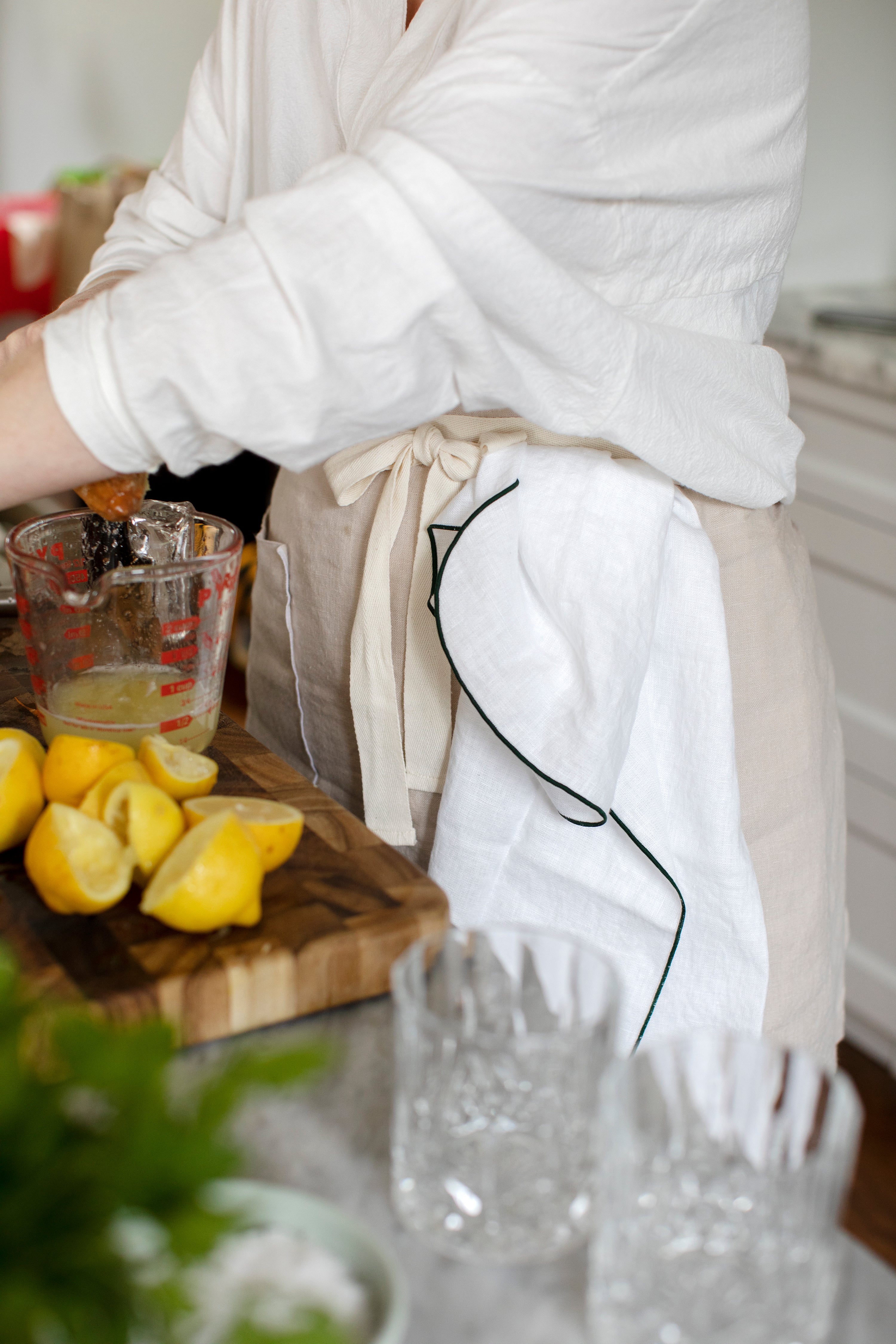 Flax Home long, wrap around linen Chef's Apron in the colour Stone.