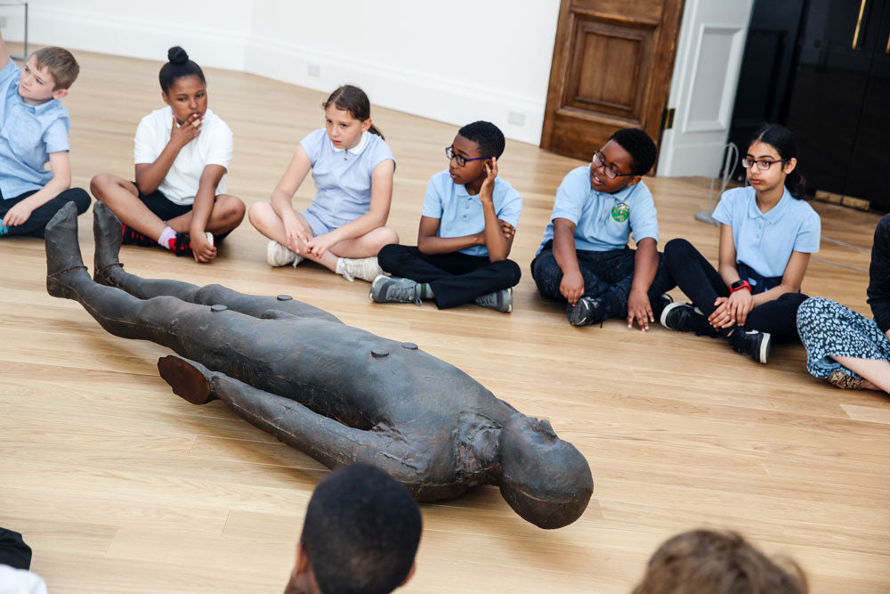 School children sat around a sculpture in the RWA galleries