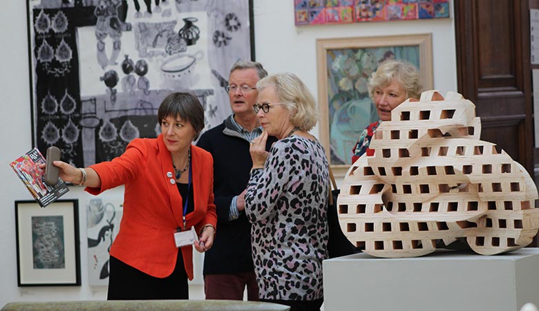 RWA Director Alison Bevan shows patrons around the RWA art galleries