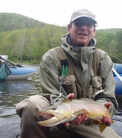 St. Croix International Sales Manager Greg Goddard with a big brown trout