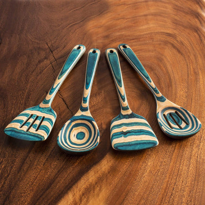 Add a splash of cool color to your kitchen with the Baltique Mykonos  Collection Cooking Spoon with Spoon Rest Notch. This eye-catching utensil  is masterfully crafted from layers of colored birch wood