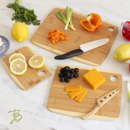 https://cdn.shopify.com/s/files/1/2298/4179/products/3-piece-two-tone-bamboo-serving-and-cutting-board-set-totally-bamboo-619263_420x.jpg?v=1628120573