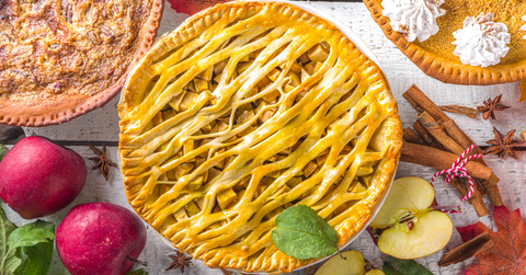 Fall-themed pies on a table.