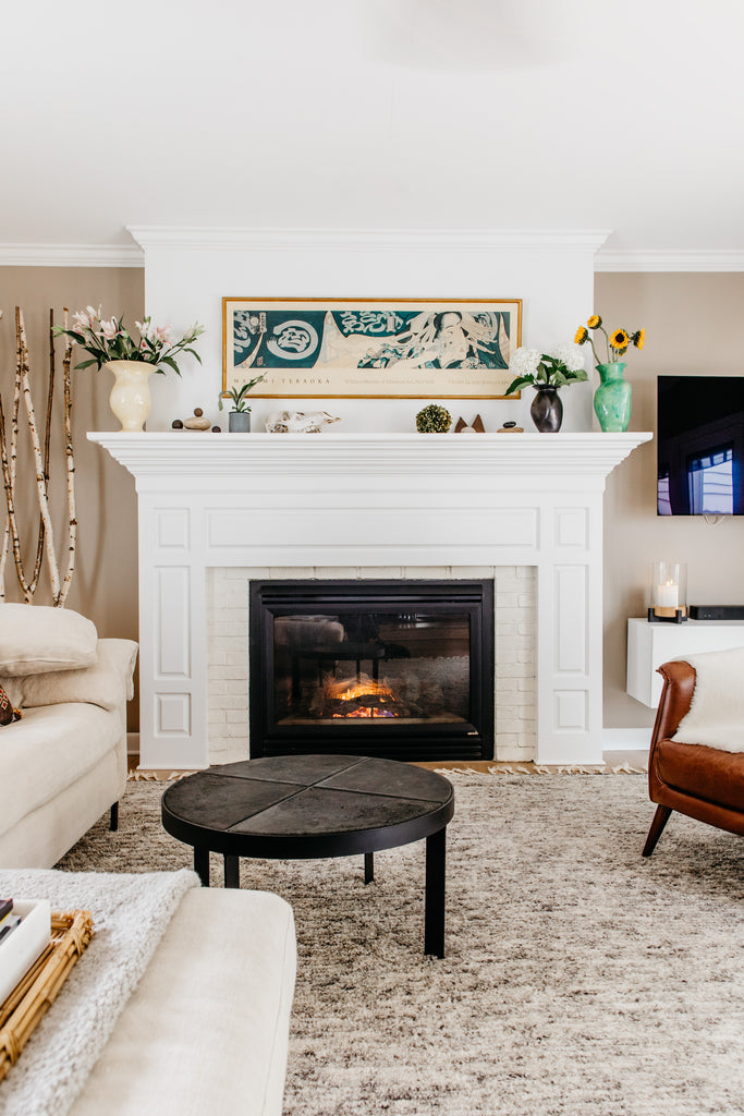 Cisco Brothers Radley sectional with modern, black & grey moroccan style undyed wool rug.  Gilded mona lisa quirky art.