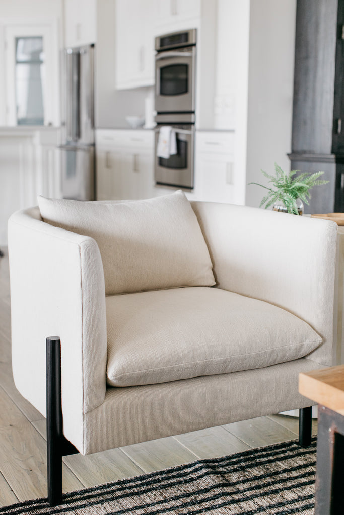 The accent chairs are a modern marvel -- with three legs in black Ash Wood in creamy, unique textile -- the seat depth & recline is ideal for watching a mounted television. This chair silhouette is exclusive to the Belgian-inspired Verellen collection. So dreamy and not something you see every day!