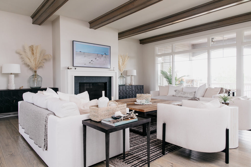 Verellen excelled with the custom order Thibaut sofas in the precise white upholstery needs of the client. The black cabinets bring a modern look to this beach house and interesting contrast.