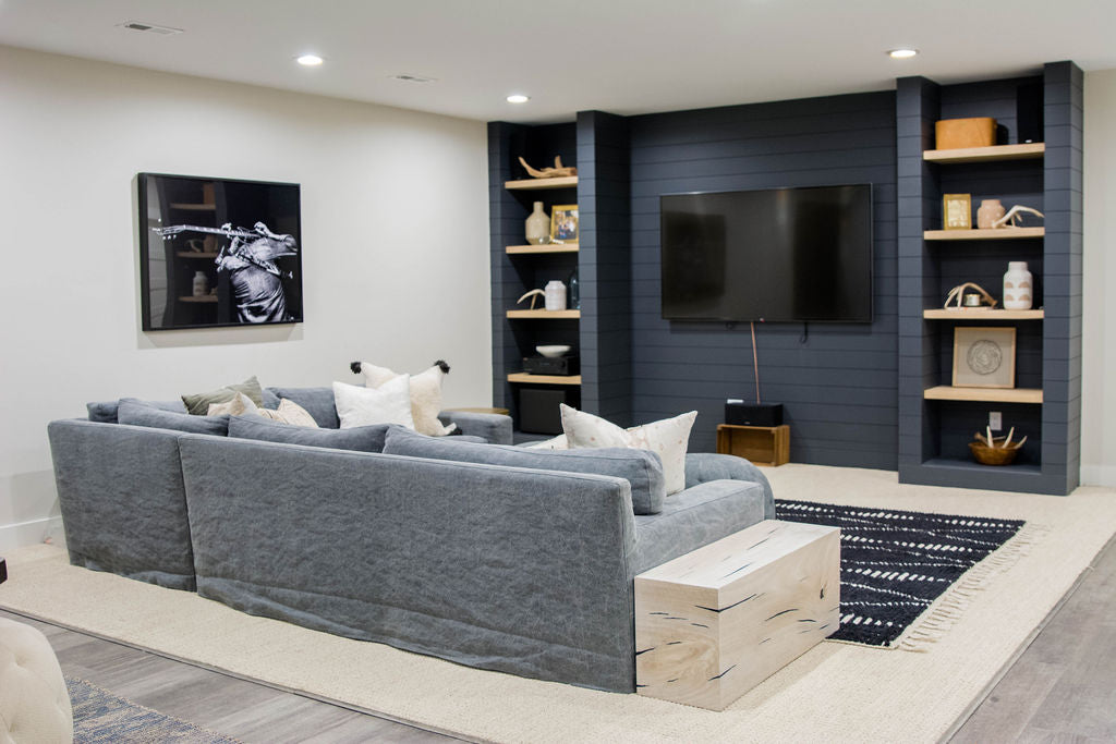 The Loft sectional sofa from Cisco Brothers even looks gorgeous from the back with the slipcovered tailored to sit directly on top of any surface. We love seeing the Ario pillows and the Fret Art to add rock'n'roll style to any room.