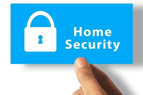 hand holding a home security sign