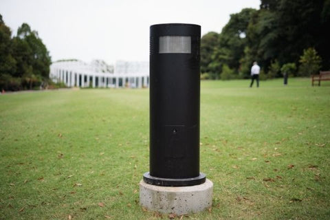 black bollard light erected in a grassy ground