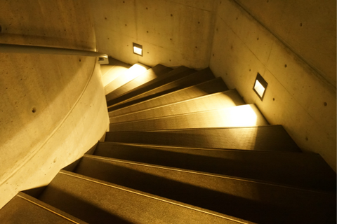 brown staircase with lights