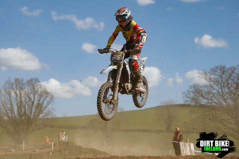 Dirt bike racer racing on a dusty track. The air filter is the only line of defense for keeping that dust out of the engine.