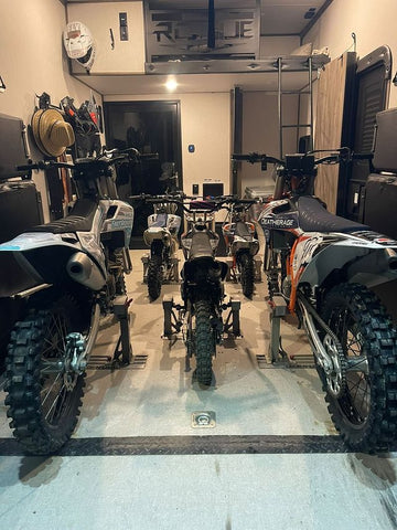 Five dirt bikes loaded into a toy hauler that also converts into a living space. This means space is limited and every inch counts.  The lock-n-load system form risk racing maximizes space.