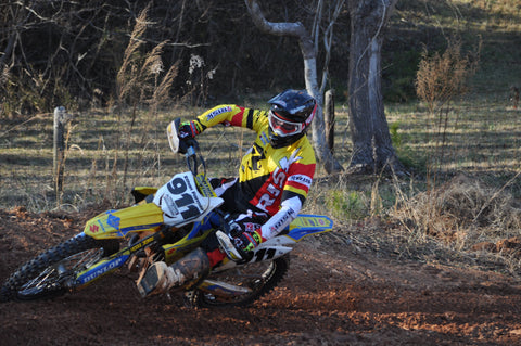 rider using the inside leg to transfer weight to the front of the bike so they can keep they can keep the front end planted through the corner.