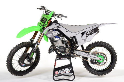 Kawasaki dirt bike outfitted with a unique color wave of graphics to express the riders style. The graphics will protect the bike as much as they are aesthetically appealing.