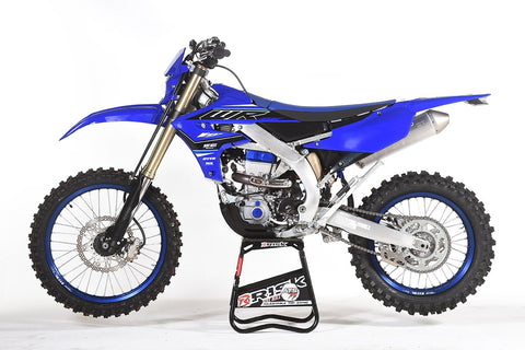 Yamaha WR250F resting on a risk racing A.T.S. Stand. This bike comes with a kickstand stock but the owner of the bike has removed it for the reasons listed above.