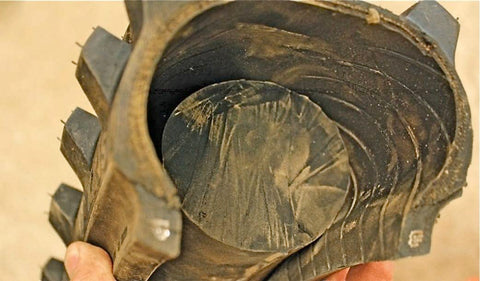 Tire cut to demonstrate how a bib mousse works. The rubber insert simply lays inside the the inside of the tire and does not require any air. 