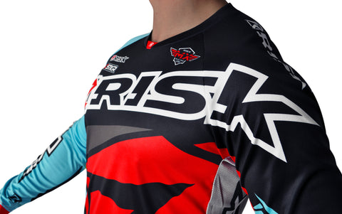 Motocross gear that is loose enough to allow a full range of motion, and tight enough to ensure maximum protection and no separation exposing the riders skin. The gear set pictured is risk racing's ventilate v2 red and teal motocross gear  