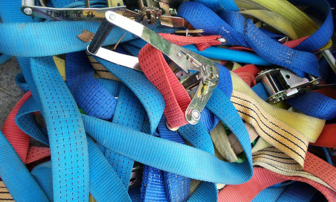 A tangled mess of multicolored ratchet straps. 