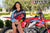 July's Risk Racing Moto Model Samantha Heady posing in various bikinis & Risk Racing Jerseys next to Alex Ray's Honda CR250R that's sidding on a Risk Racing ATS stand - Pose #7