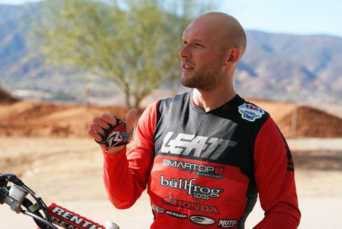 Professional supercross and motocross racer shane mcelrath wearing risk racing palm protectors during a day pf training on the bike