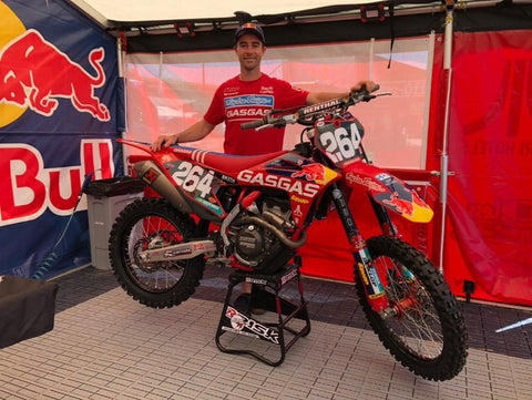 professional supercross/motocross racer ryan sypes aka the general posing behind his gas gas dirt bike resting on a risk racing ats stand.