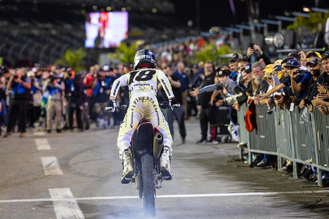 Professional supercross and motocross racer jett lawrence during a burnout on his honda after a supercross win.