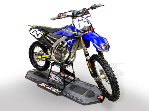 Motocross bike on Risk racing A.T.S Stand & Factory pit mat. The ultimate set up for working on bike anywhere.