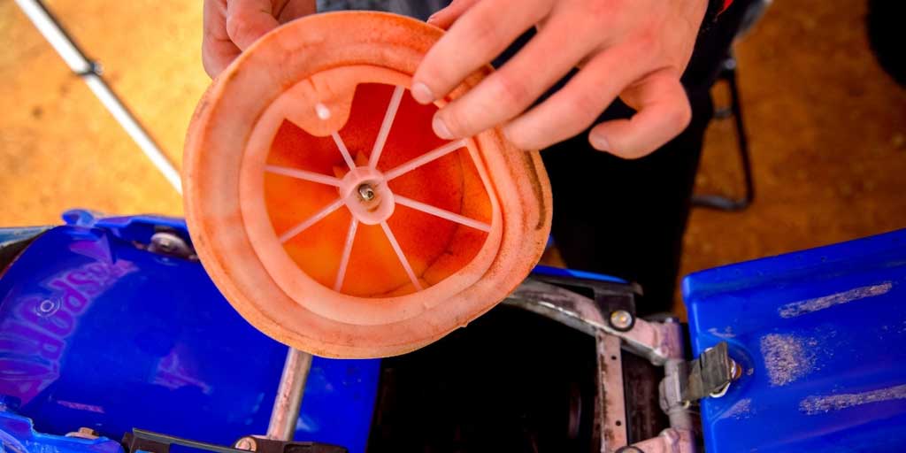 close up of a dirt bike air filter just pulled from the engine