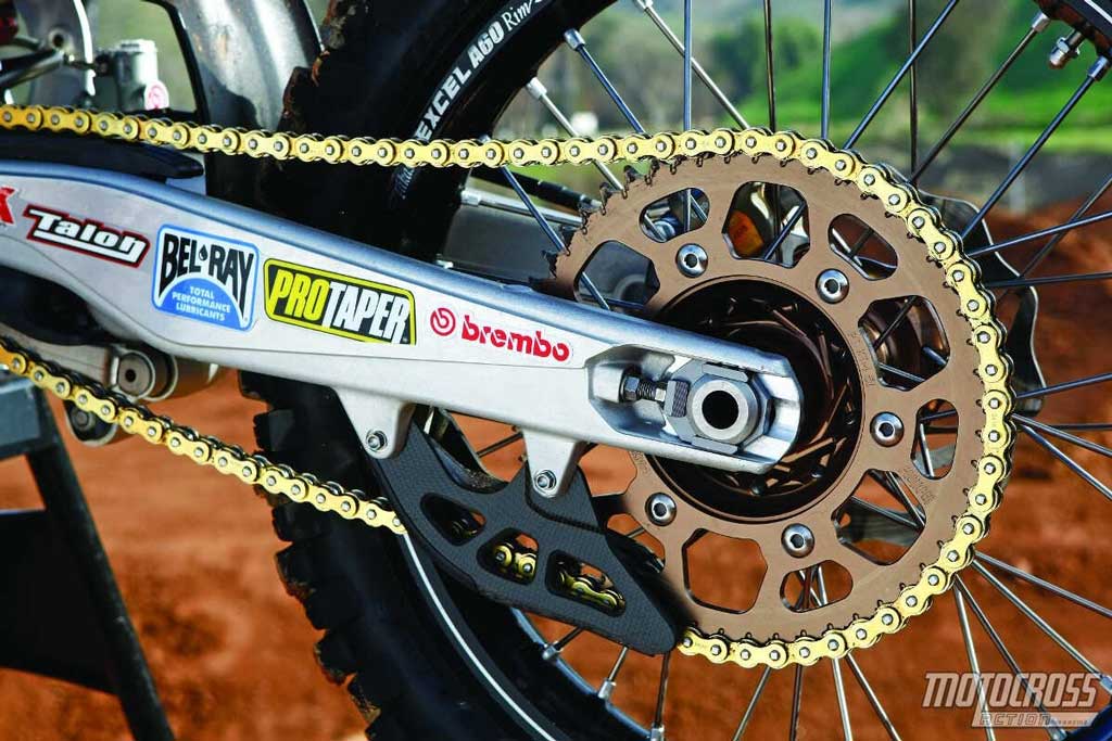 close up of beautiful and clean rear swing arm sprocket and chain pic from Motocross Action Mag