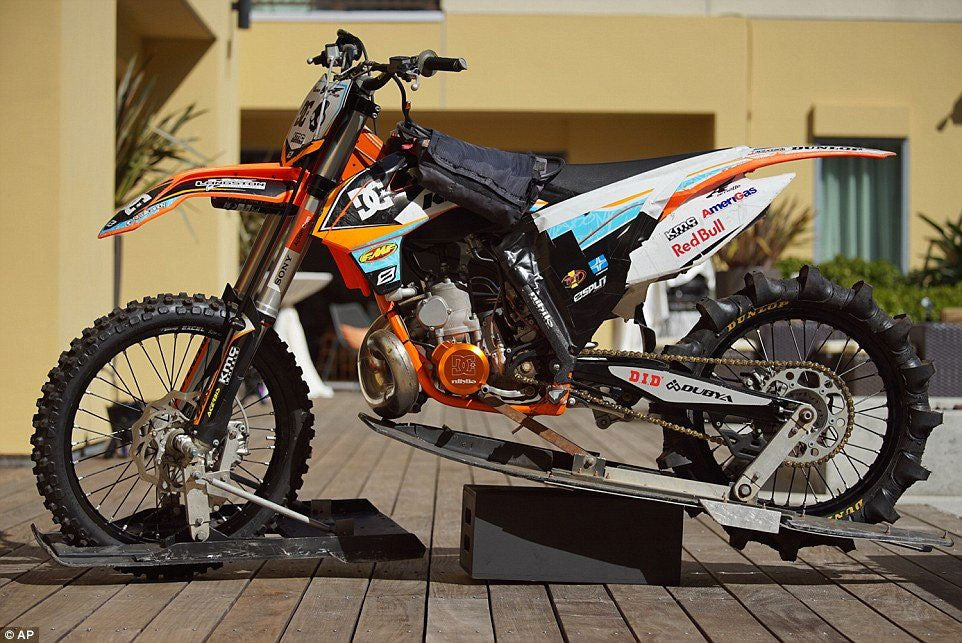 dirt bike with complete water setup inc skis on front and back and rear paddle tire